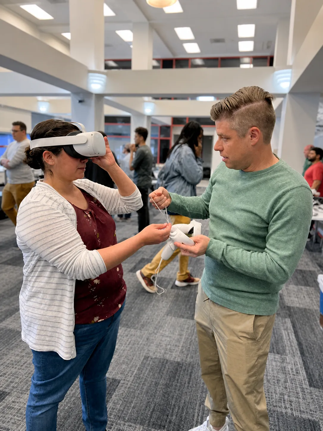 Participant testing a VR headset with a workshop facilitator