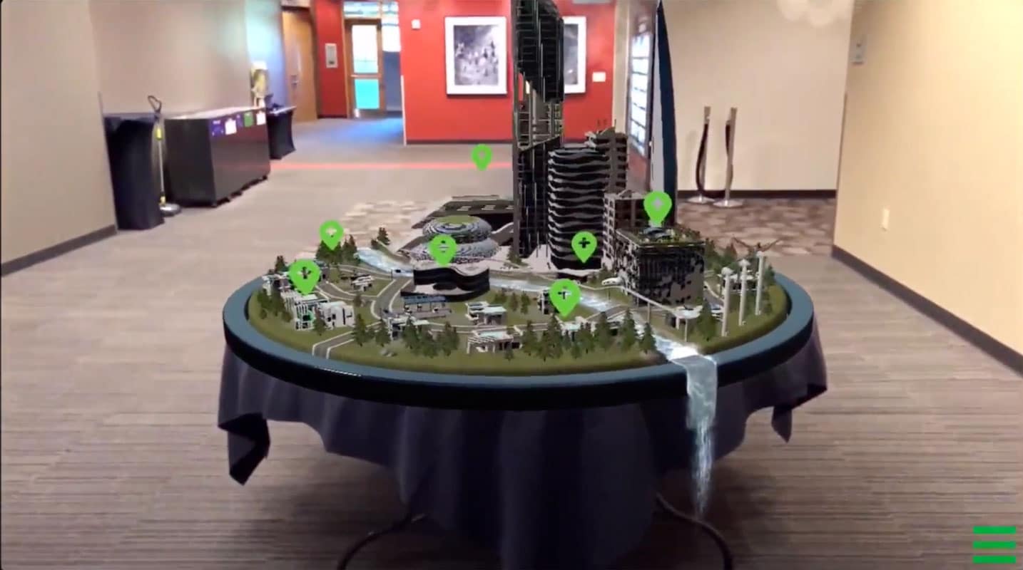 An augmented reality model of a future city displayed on a table