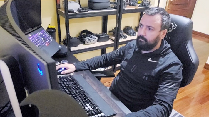 An ARS developer working at a desktop workstation