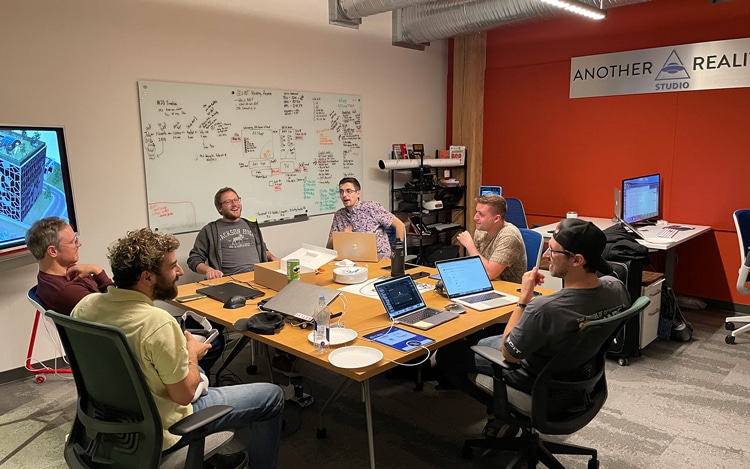 The ARS team collaborating around a conference table